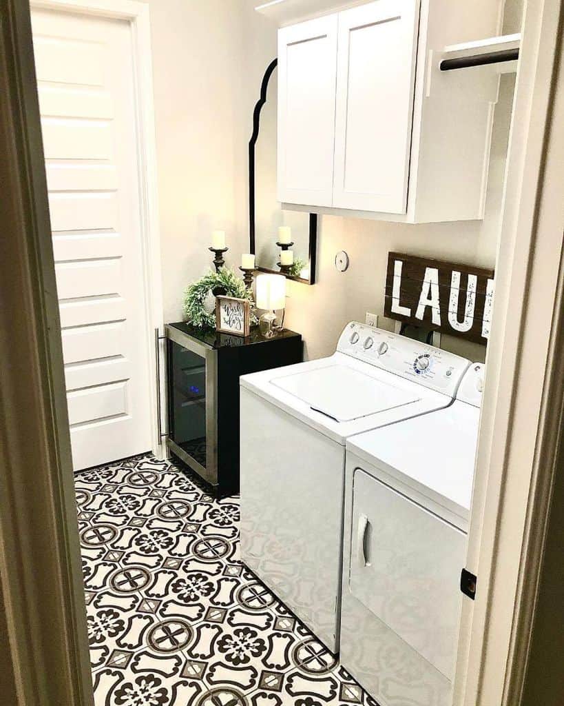 small white laundry with black bar fridge 