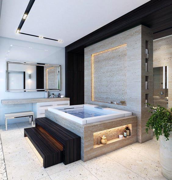 Modern bathroom with a large bathtub, steps, double sink vanity, and a potted plant