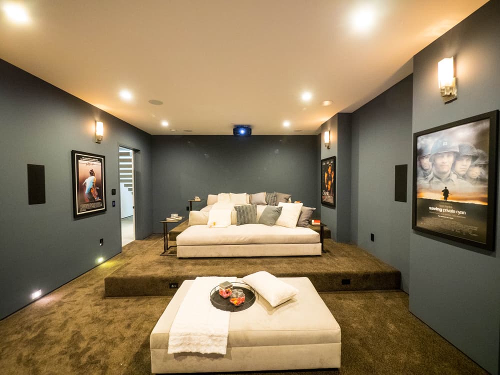 modern basement movie room with gray walls