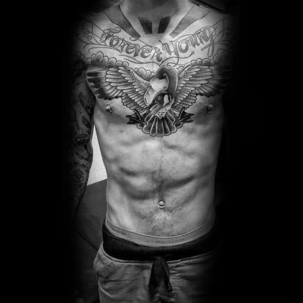 Black and gray chest tattoo of a goose with outstretched wings, detailed shading, and a banner reading "Forever Young" above, in a bold design.