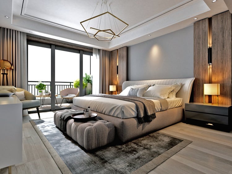 Modern bedroom with large bed, neutral tones, floor-to-ceiling windows, and elegant ceiling lighting fixtures