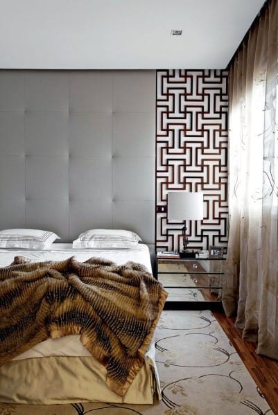 stylish modern bedroom with silver bedside table 