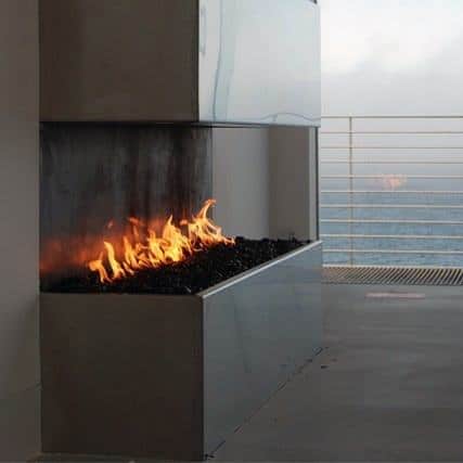 Open corner gas fireplace with a sleek metal frame and modern minimalist design.