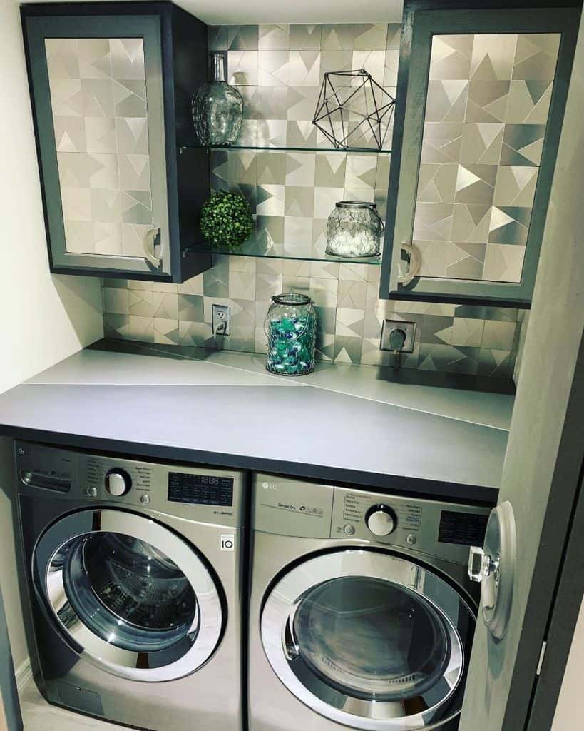 modern small laundry with unique cabinet pattern and wallpaper