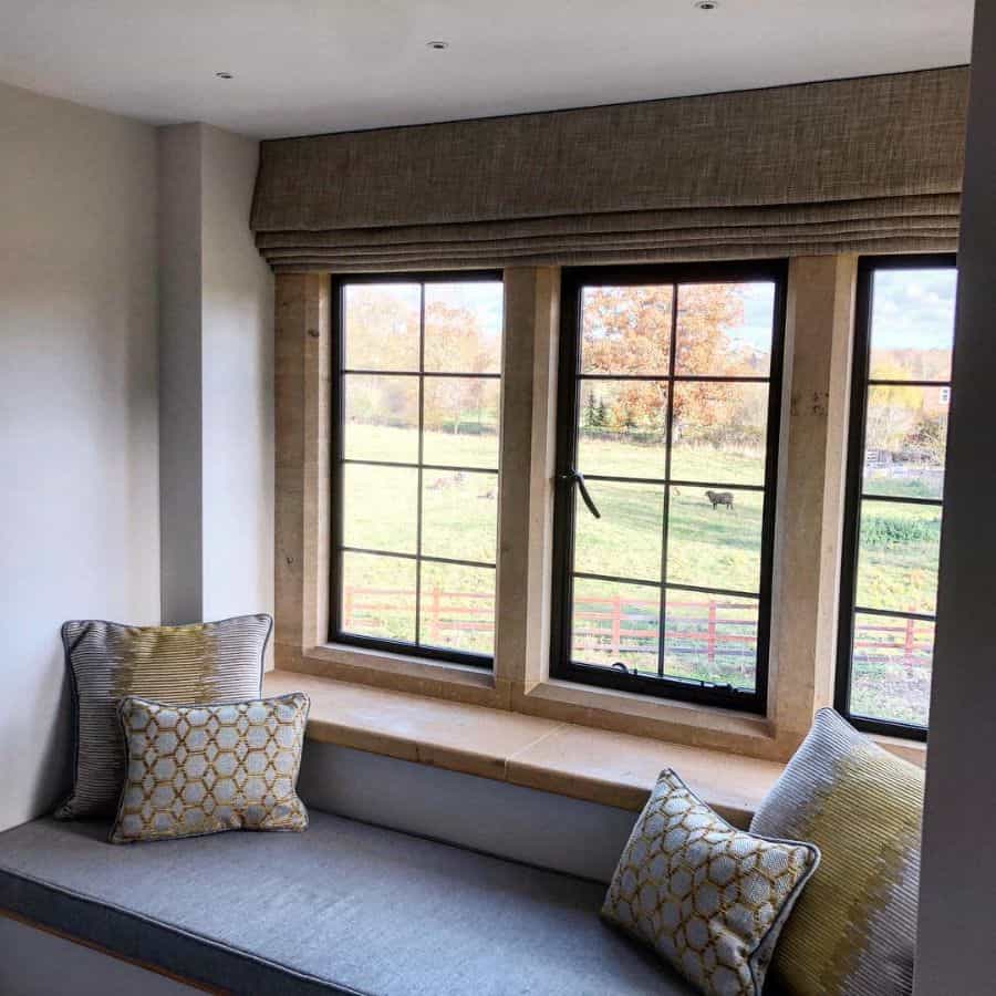 gray window seat roman blind