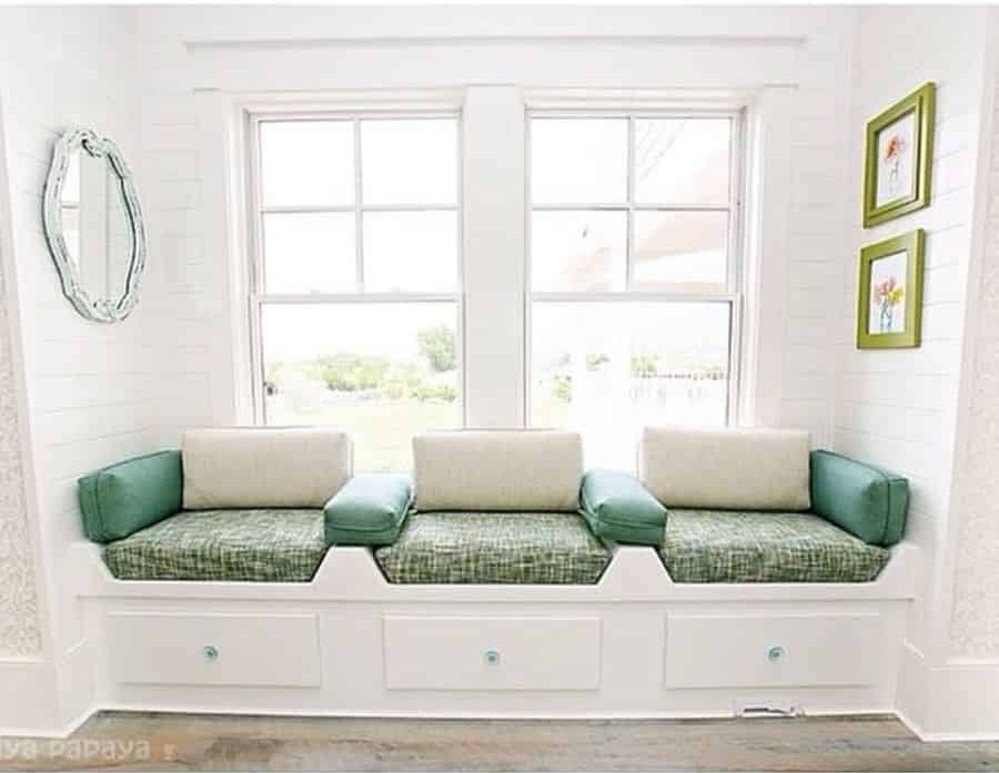 country style window seat with underneath storage green cushions