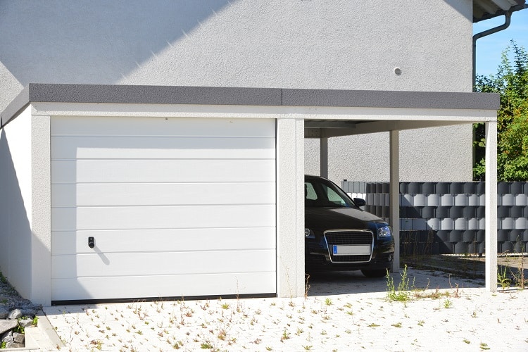 modern carport with adjacent garage 