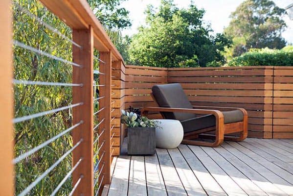 modern wood deck with wood and cable railing