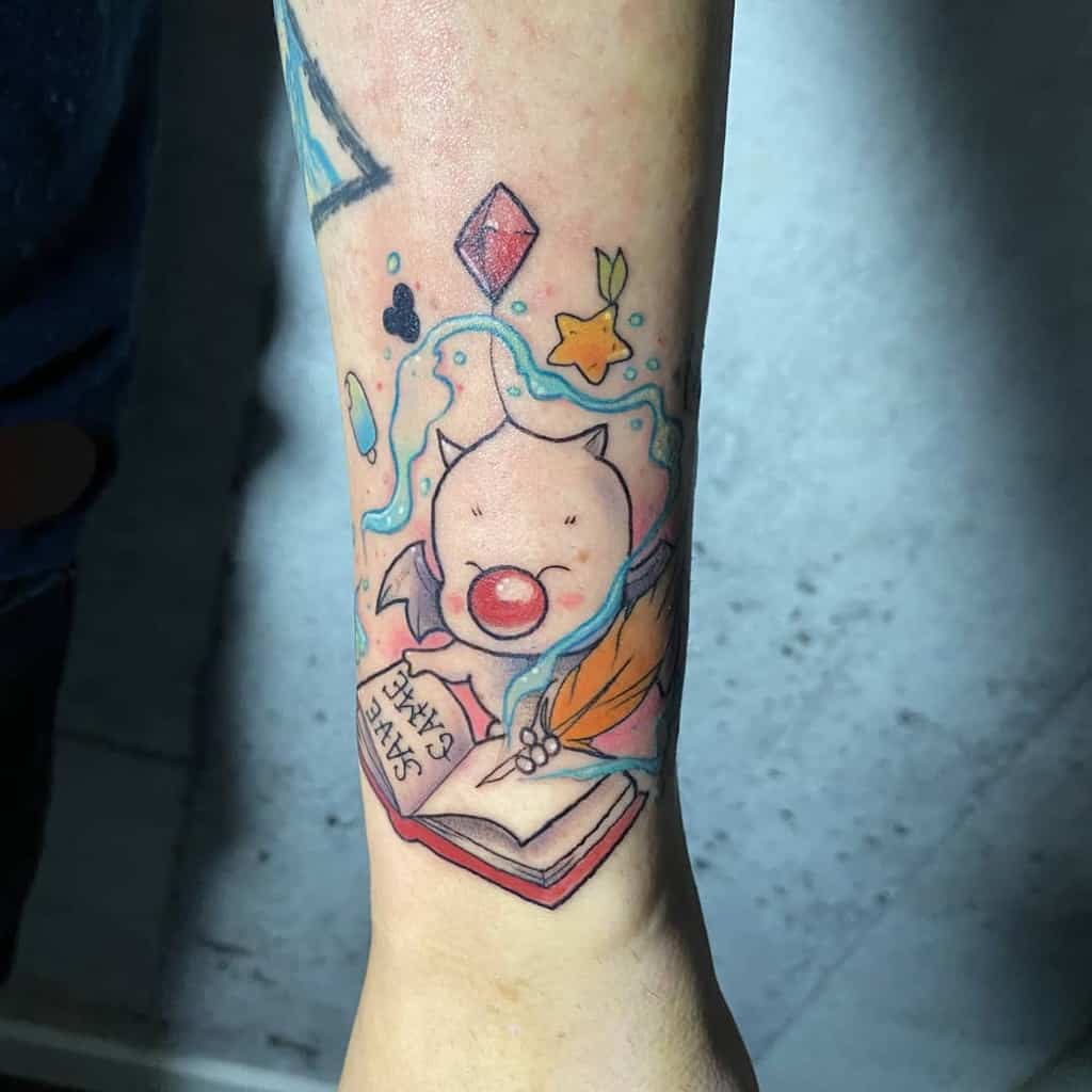 Colorful Kingdom Hearts tattoo of a Moogle reading a 'Save State' book, surrounded by magical elements, stars, and floating shapes.
