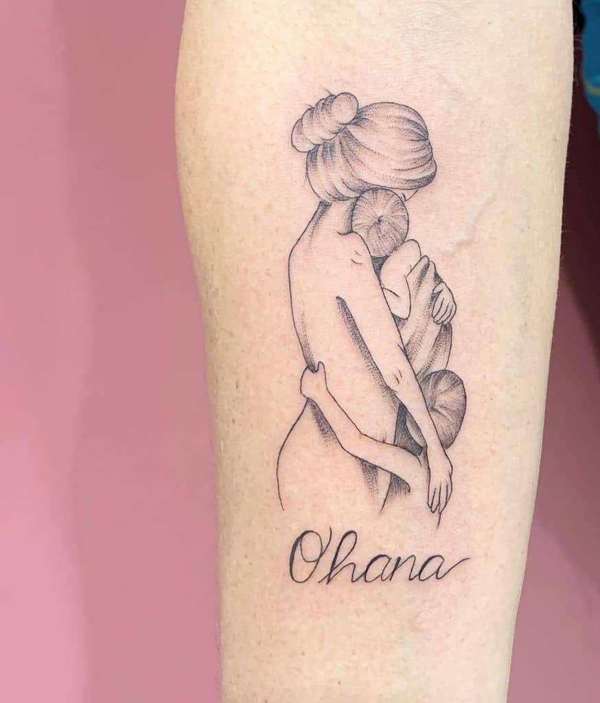 Delicate 'Ohana' tattoo featuring a mother embracing her children, symbolizing unconditional love, family, and protection.