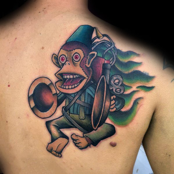 Vibrant Call of Duty Monkey Bomb tattoo on the back, featuring bold colors, dynamic flames, and expressive details for a striking design.