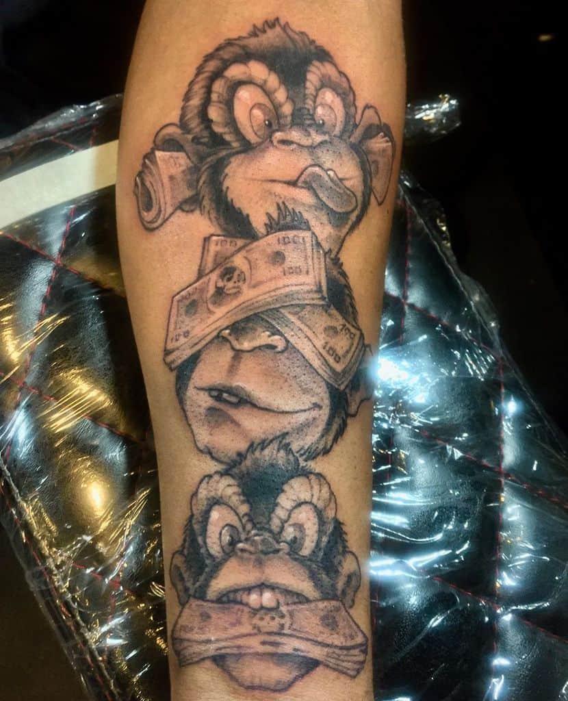 Tattoo of three monkeys: one covering ears, one with money over eyes, and one with money over mouth