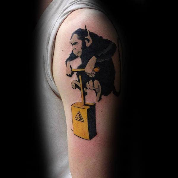Monkey Jumping On Explosive Male Banksy Upper Arm Tattoos