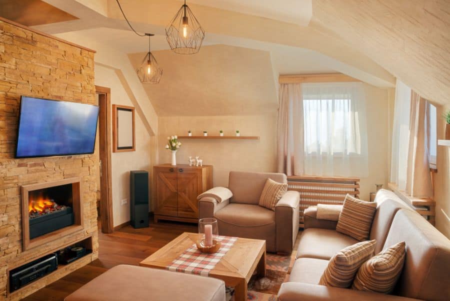 monochrome small living room with stone feature wall and fireplace