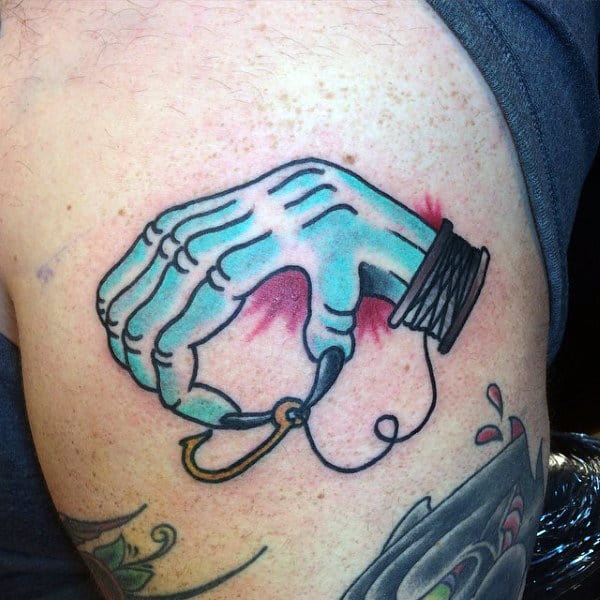 Monster Hand Holding Fish Hook And Line Reel Tattoo For Men