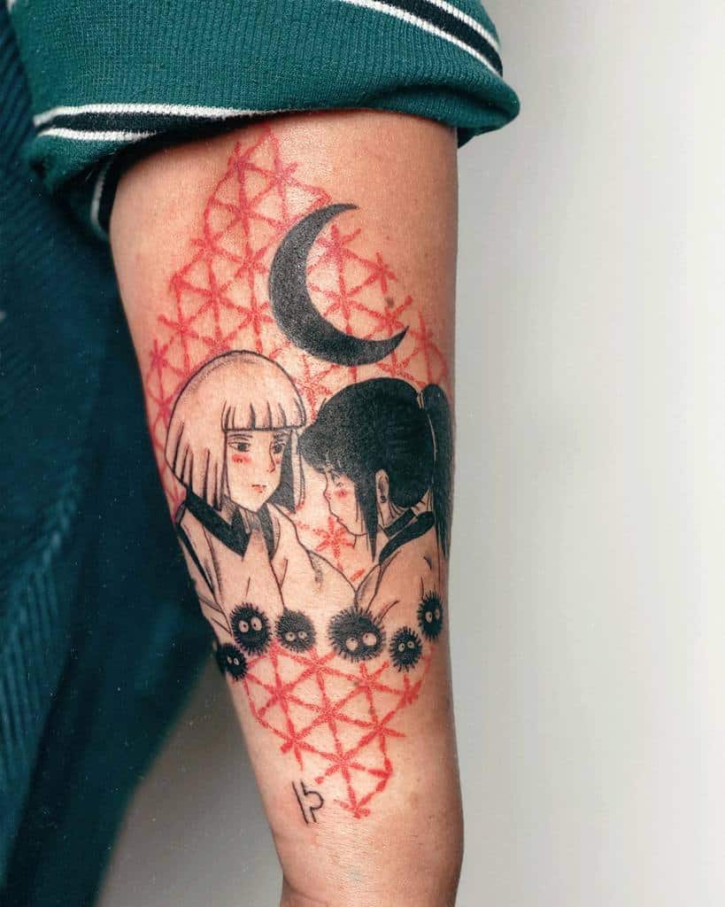 Artistic Spirited Away tattoo of Chihiro and Haku, surrounded by soot sprites, a crescent moon, and red geometric patterns for a mystical effect