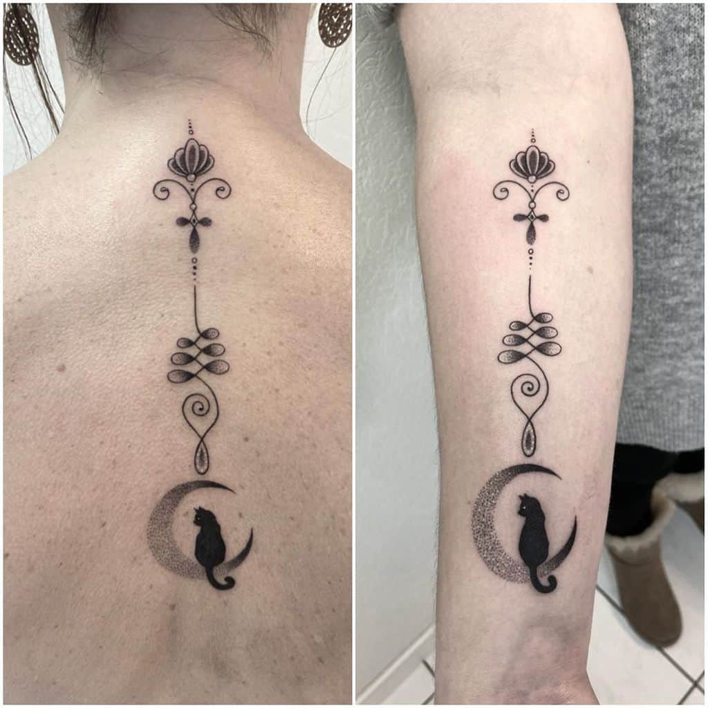 Unalome tattoo with a crescent moon and cat design on the back and arm, symbolizing mystery, intuition, and the journey to enlightenment.