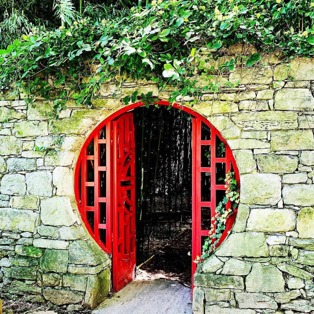 red moon gate stone wall
