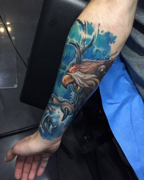 Colorful tattoo of a fierce gryphon from World of Warcraft, surrounded by blue energy, with sharp details, inked on the forearm.