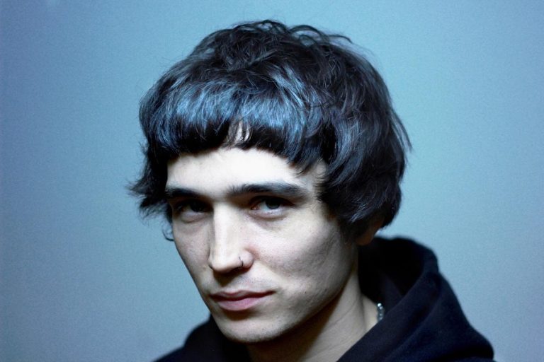 man with 1990s moptop hairstyle