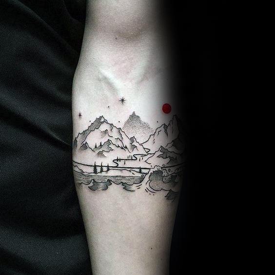 Minimalist mountain and wave tattoo on forearm with fine linework, a red sun, and small stars, creating a serene landscape design.