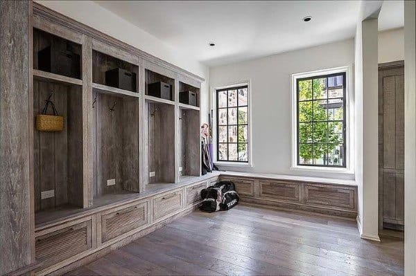 large wood mudroom with storage
