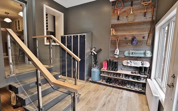 cabine style mudroom with sports equipment