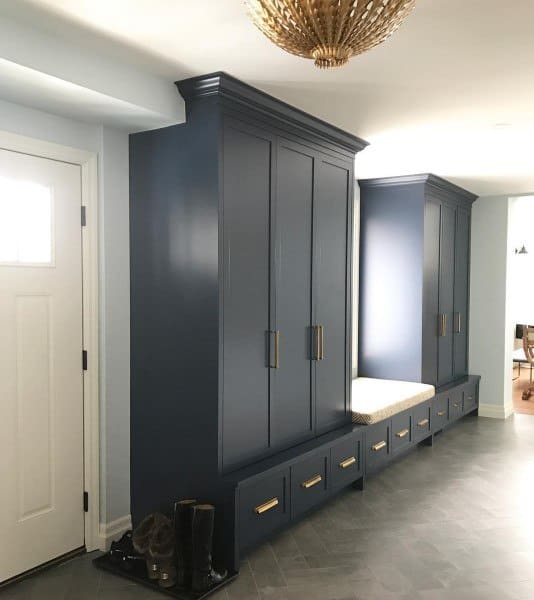 gray cabinets with gold handles in mudroom