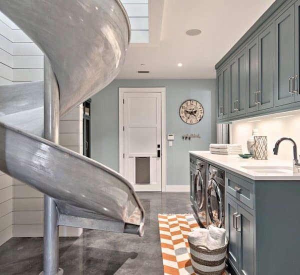 modern mudroom with blue cabinets and slide