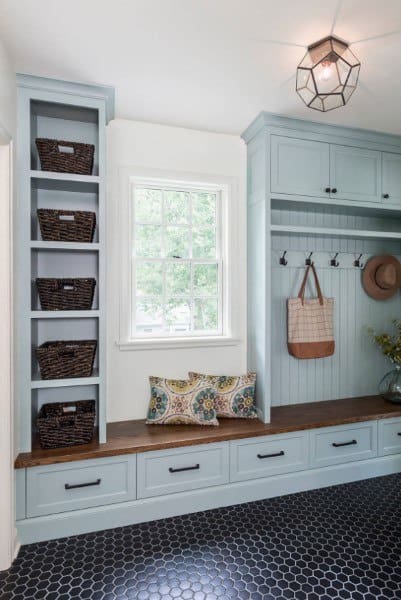 blue cabinet mudroom with weaved basket storage