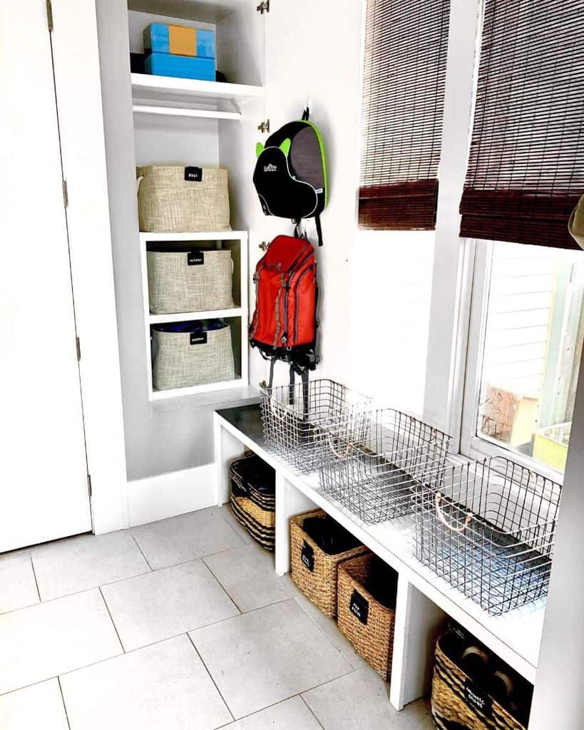 modern mudroom with basket storage and wall shelves