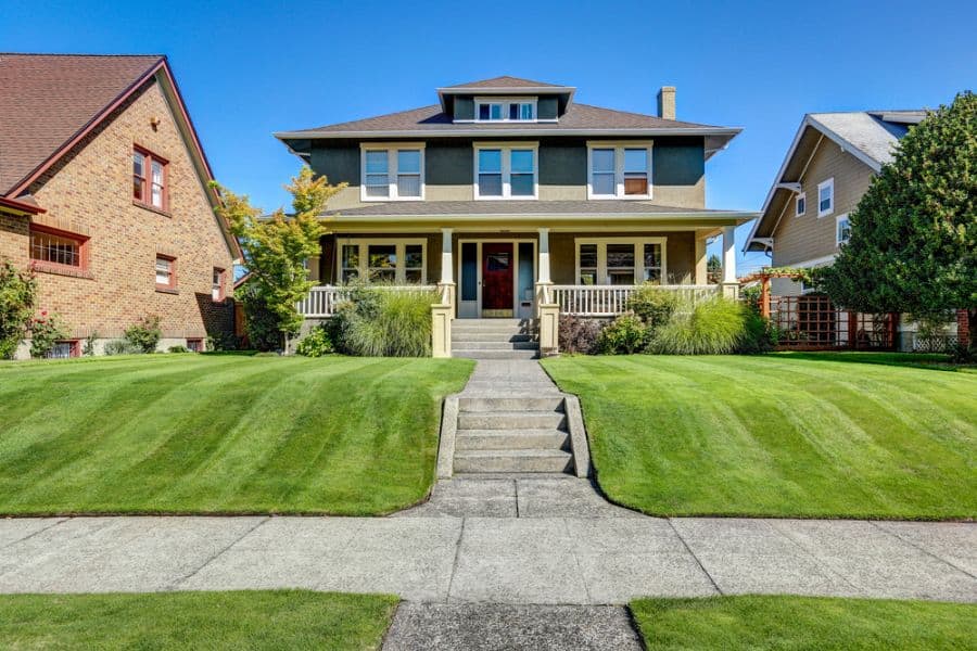 multilevel craftsman house large front lawn