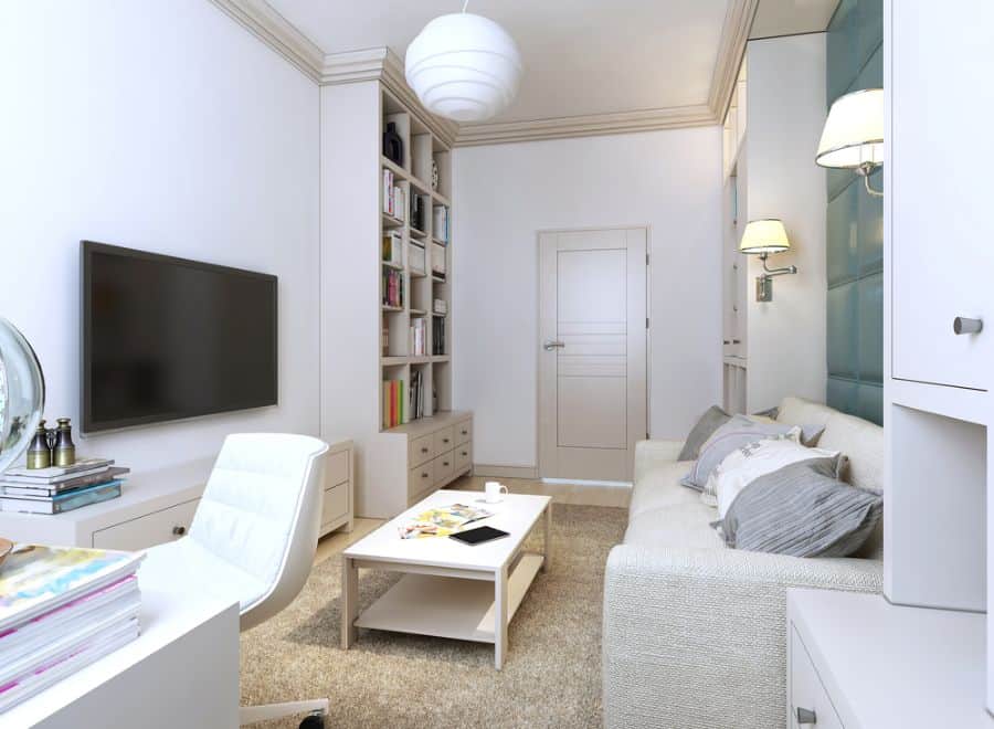 large office living space gray couch book shelf wall mounted tv