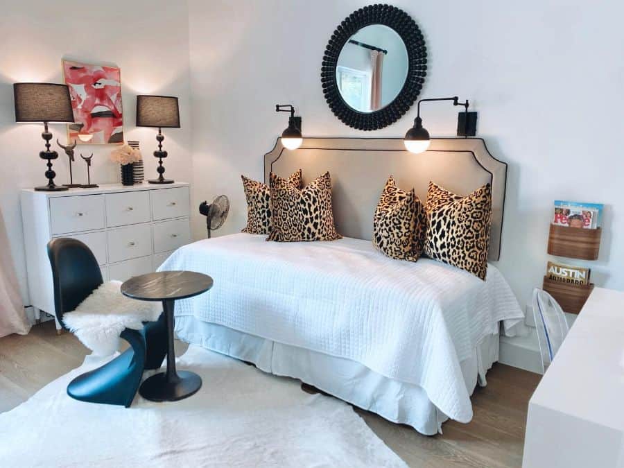 daybed white cabinets tiger print pillows small table and chair magazine wall rack