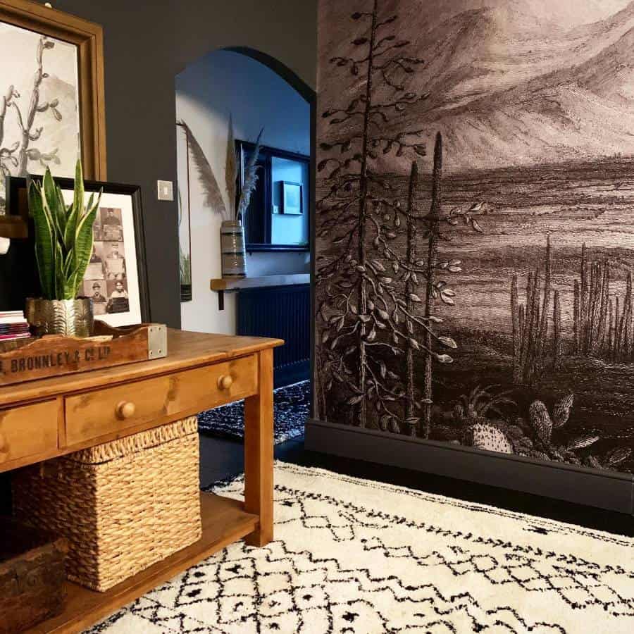 Cozy room with a wooden table, plant, woven basket, and a large nature-themed accent wall mural