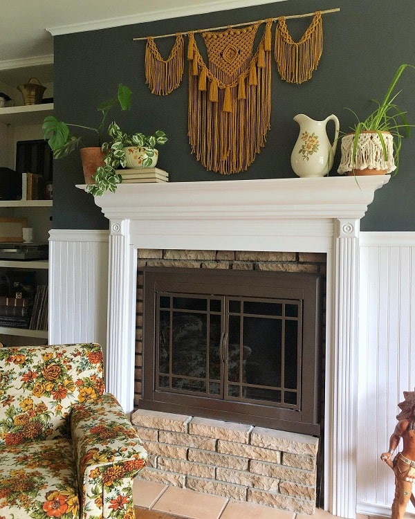 white fireplace with floral pattern sofa chair