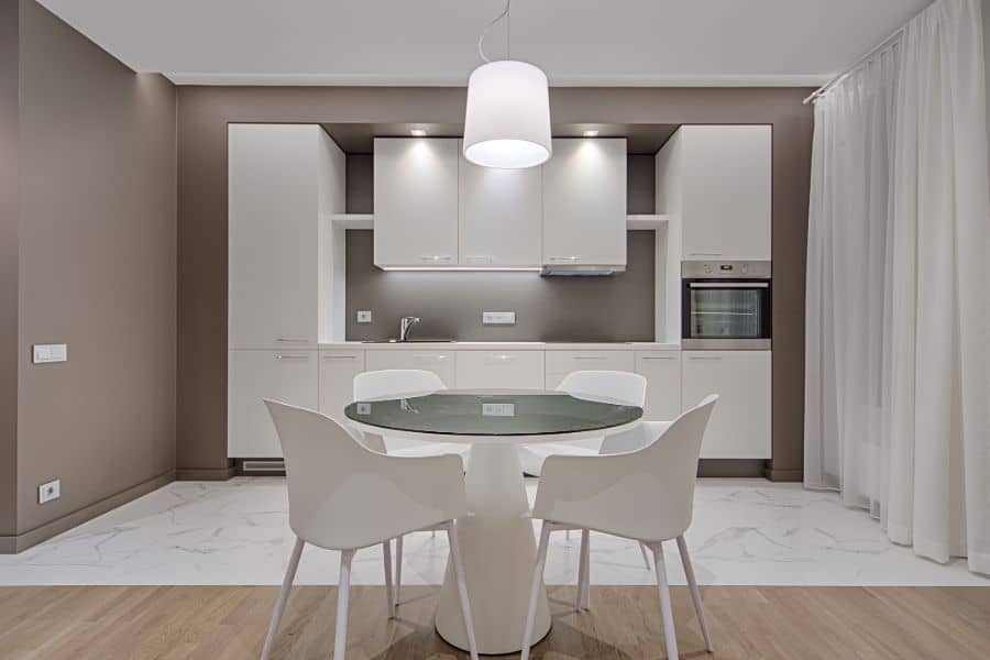 neutral kitchen white cabinets dining table