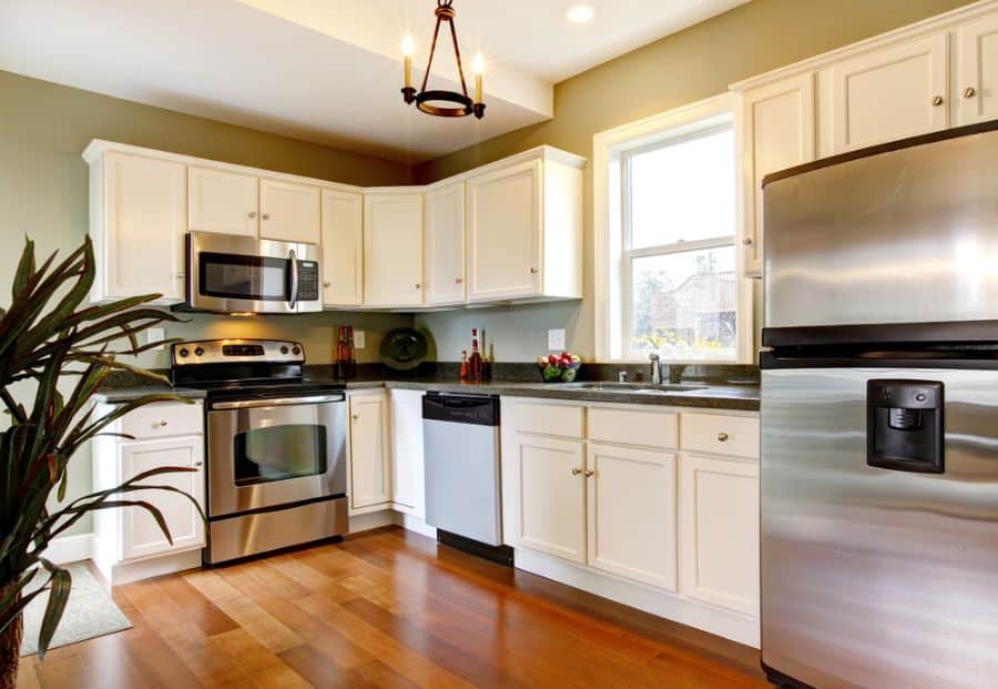 white cabinet kitchen wood flooring