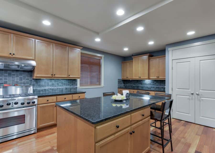 wood cabinet kitchen black granite countertop