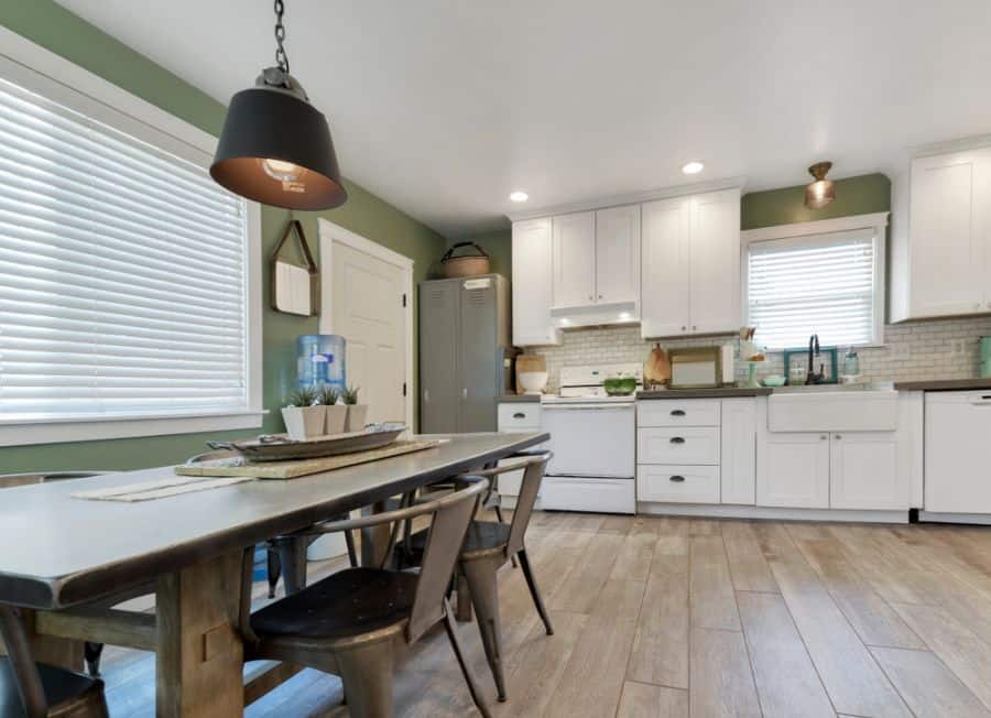 rustic kitchen white cabinets wood dining table and chairs