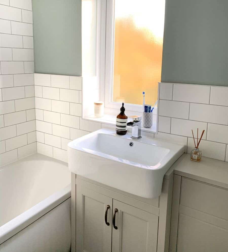 green and white tile wall bathroom 