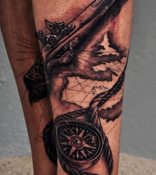 Muted Pistol And Compass Tattoo On Calves For Men