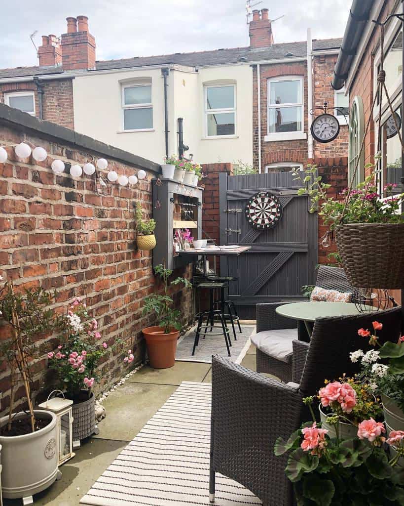 narrow backyard garden with paver patio