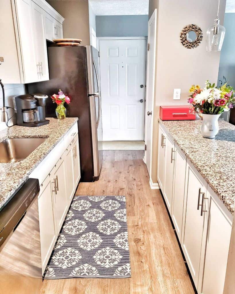 narrow kitchenette white cabinets granite countertop