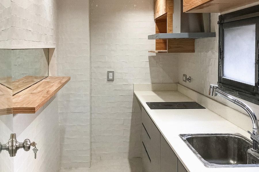 narrow kitchen with gray cabinets