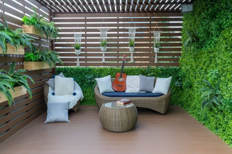 small wood deck patio with wicker furniture