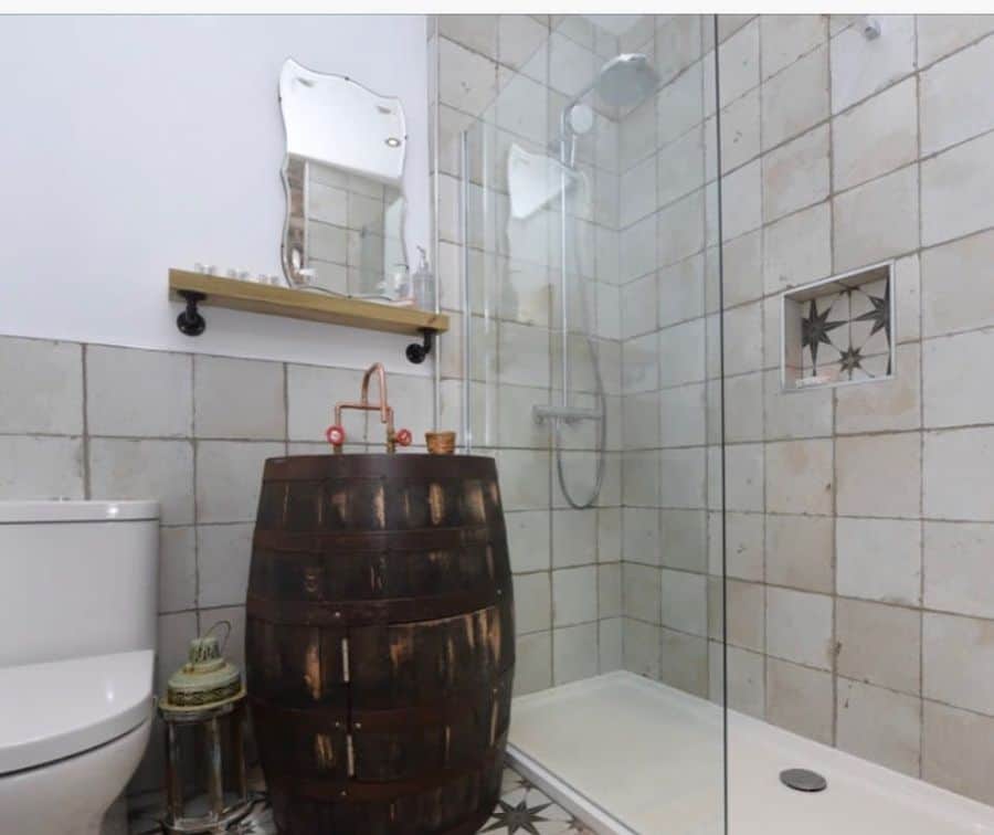 small shower with wood barrel