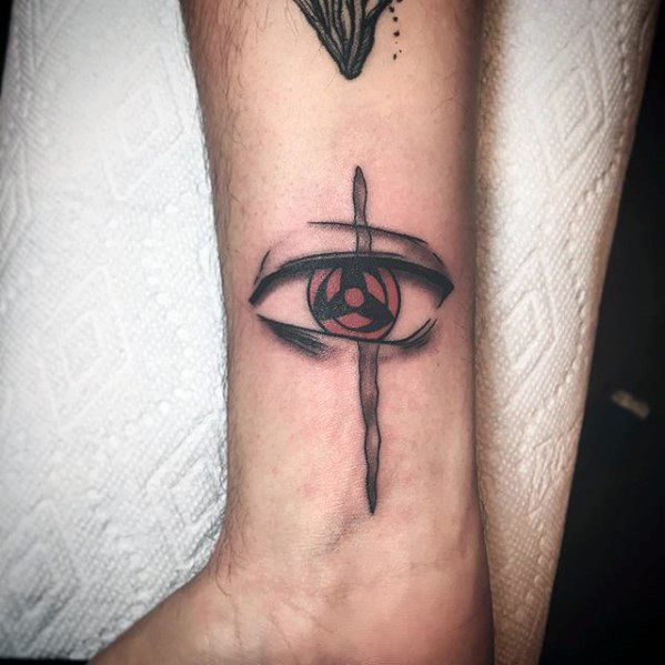 Tattoo of a stylized eye with a red symbol inside, crossed by a vertical line, inspired by Naruto
