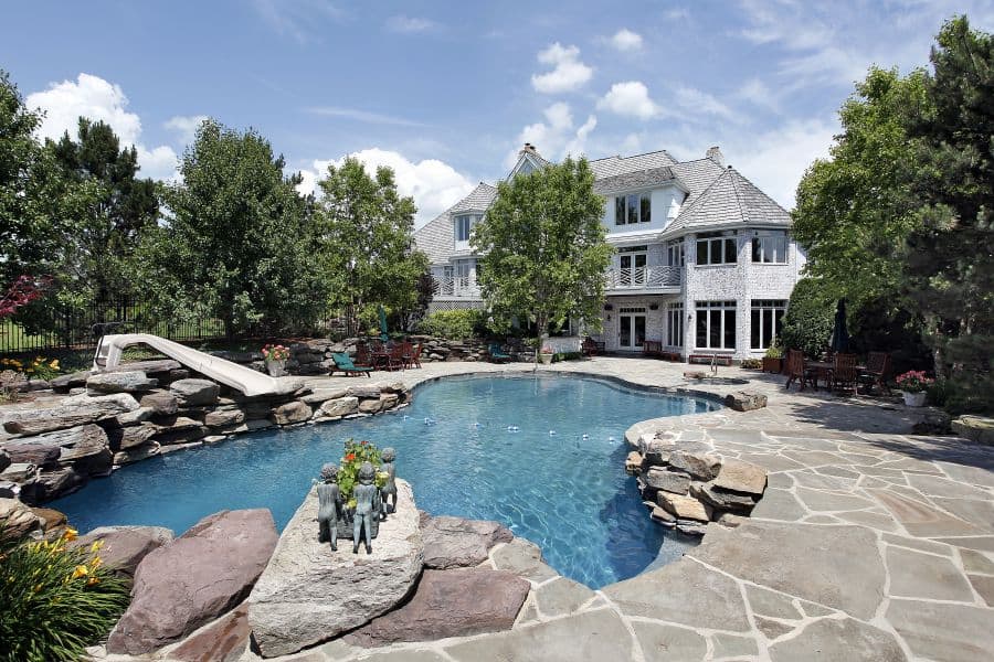 natural stone pavers pool deck with slide
