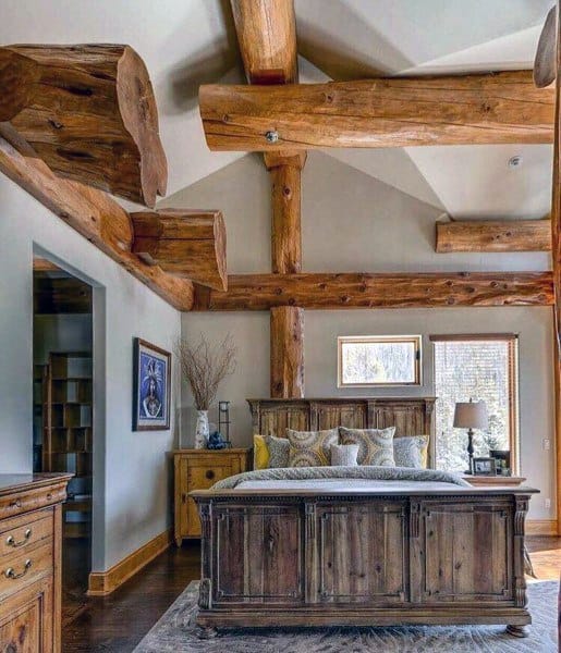 rustic bedroom with exposed wood beams